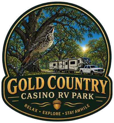 Logo for Gold Country Casino RV Park featuring a bird on a branch, an RV with a parked truck, trees in the background, and the tagline 